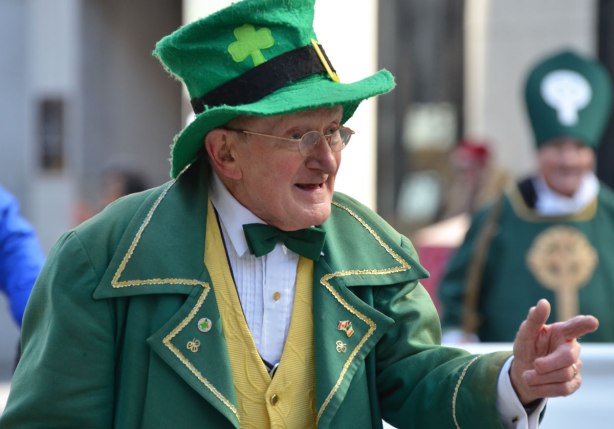 an older man in green Irish tophat and green coat and green bowtie