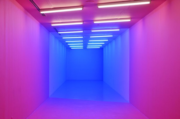 a hallway is lit in pink and blue lighting, covers all walls and ceiling too 