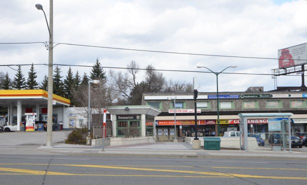 looking across the street to the small north entrance to Bessarion subway station, with a small two storey plaza beside it 