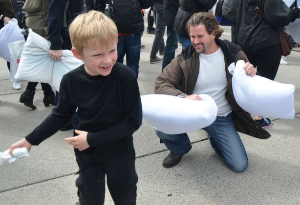 people, pillow fight, Nathan Phillips Square, father and son