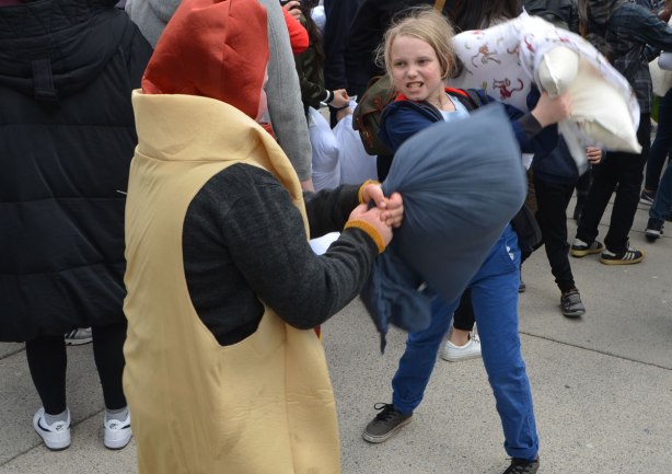 people, pillow fight, Nathan Phillips Square, a girl and a boy wearing a hot dog costume