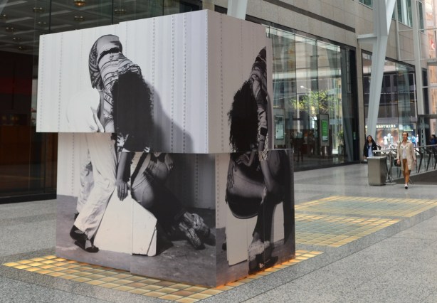 a large stack of blocks with black and white photos of people on them by Valerie Blass. 