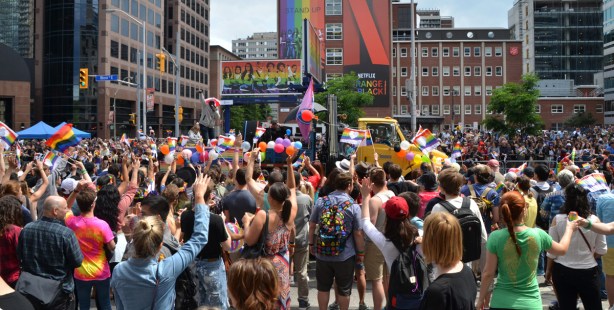 crowd watching the pride parade on Bloor Street