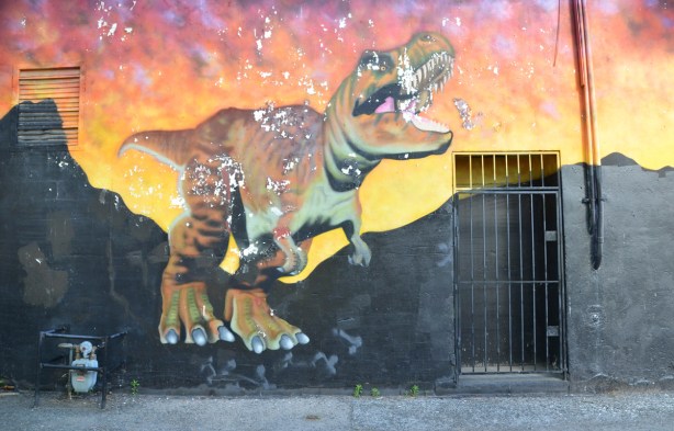 part of a mural with a dinosaur 