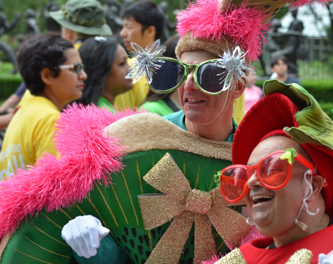 two men in fruit costumes as well as large oversized glasses 