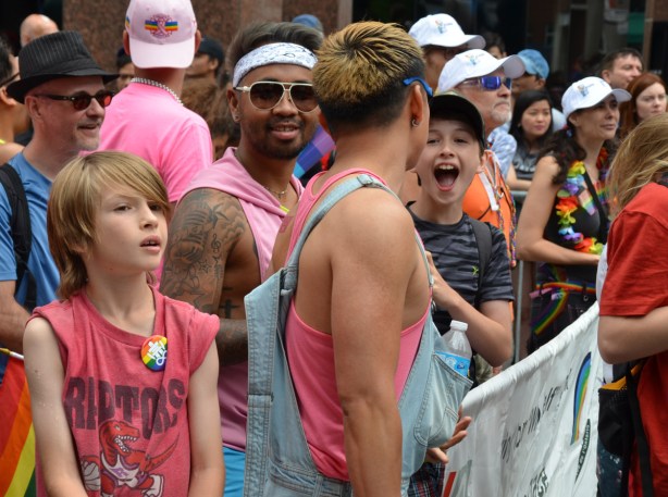 a group of boys and young men at the start of the pride parade