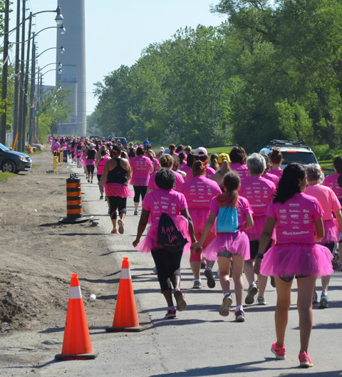 pink tshirts an dpink tutus, Run Like a Diva, runners running down Unwin street