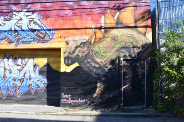 part of a mural with a stegasaurus dinosaur