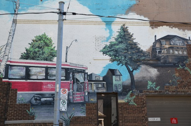 a mural of a ttc streetcar and a house