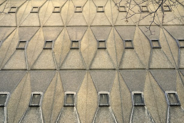 trapezoid sections on a concrete exterior wall 