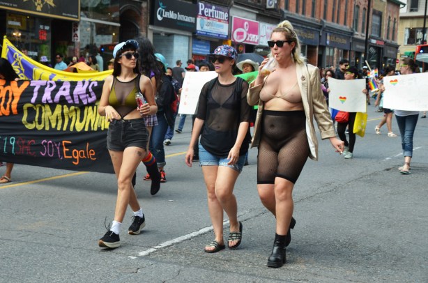 three women walking together in the dyke march