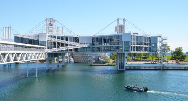 buildings with lots of glass, on stilts, built over the water at Ontario Place