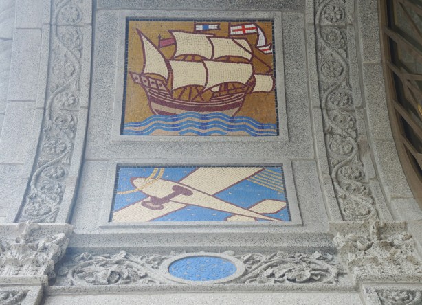 two of the panels designed by J.E. H. MacDonald on the Concourse building, a ship with sails, and an airplane 