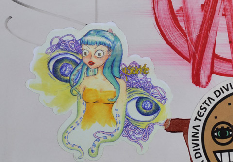 small sticker of a girl with long turquoise hair, staring straight ahead, wearing a low cut yellow dress. Behind her is pair of eyes