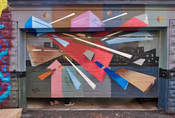 geometric abstract mural in browns and red and blues, by andre