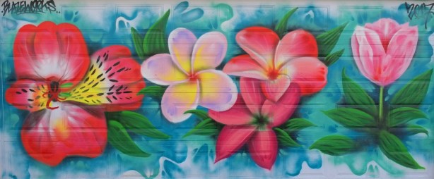 big bright pink flowers, mural on a garage door by Blazeworks