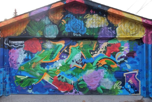 a garage covered with colour splotches