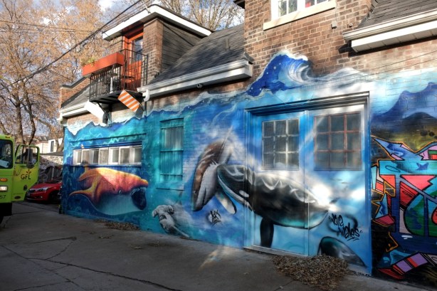 large mural with marine life theme, whale, blue background for water,