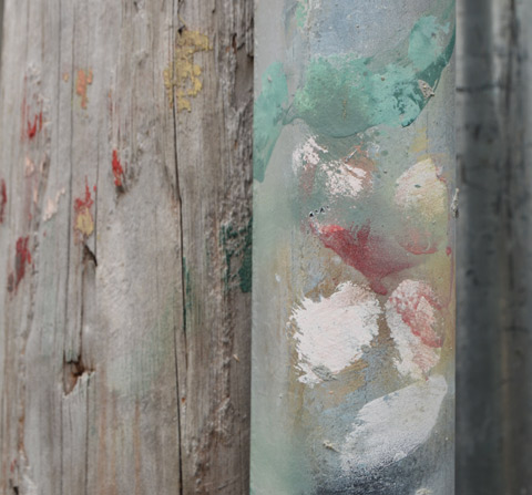 smudges on a metal pole that look a bit like flowers