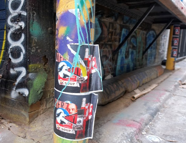 stickers graffiti in an alley