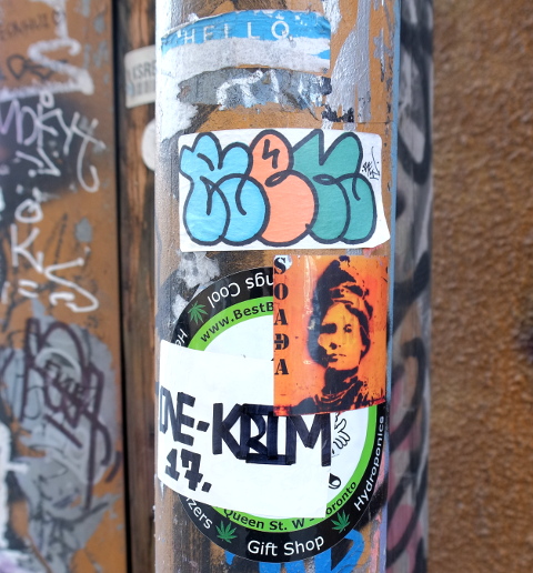 stickers graffiti in an alley