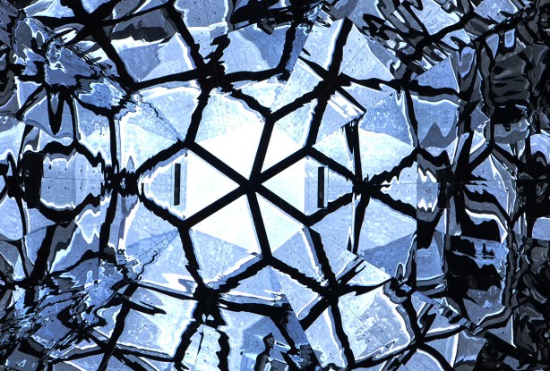 abstract geometrics, triabngles and diamonds, reflective surfaces in a cone shaped skylight, in blacks and blues,