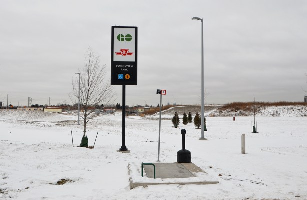GO Transit and TTC subway sign in the middle of snow covered field