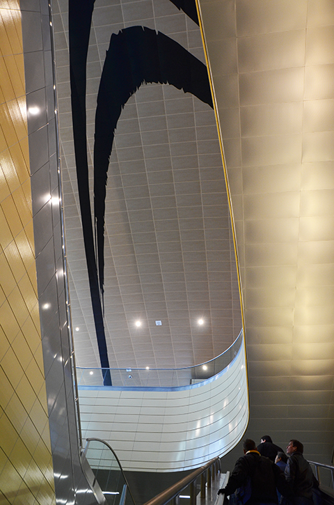 looking up over the heads of some people going up the escalator at Downsview Park subway station