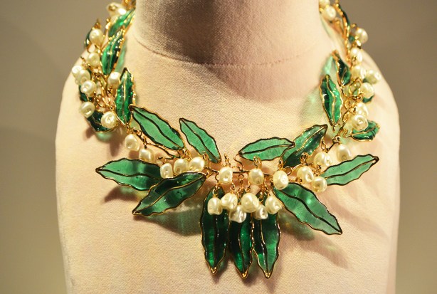 Dior necklace with green glass leaves and white flowers made of beads, gold as well, large and short 