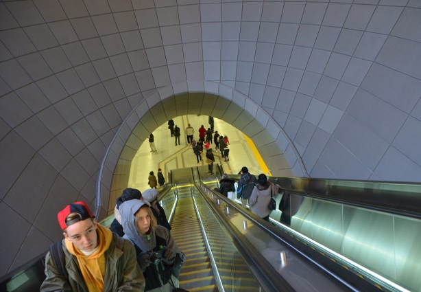 people on a very long escalator at one of the new TTC subway stations in Toronto