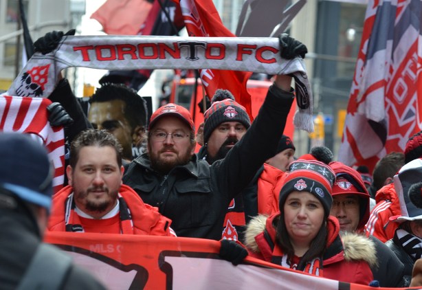 Toronto FC parade, people dressed in red and white,