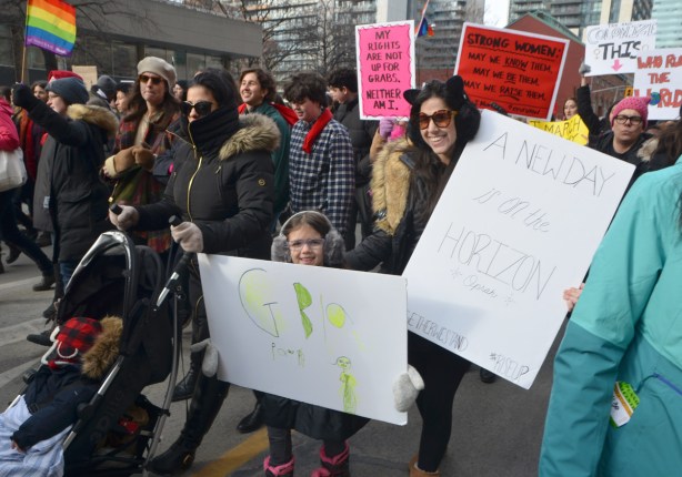 women walking down Bay st towards Nathan Phillips square and city hall, womens march 