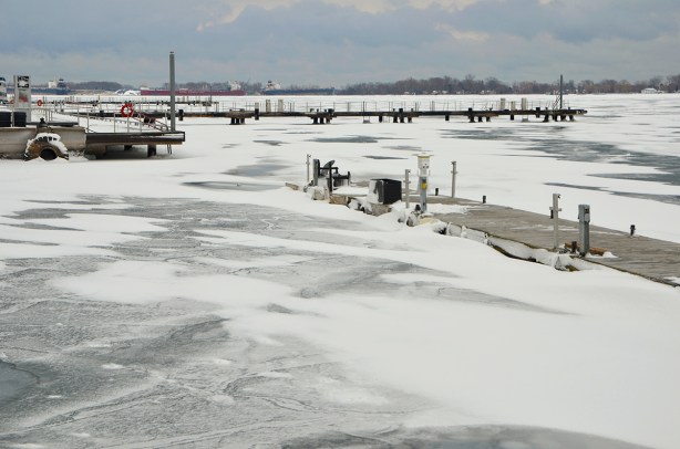frozen harbour, Lake Ontario, with some snow covered docks