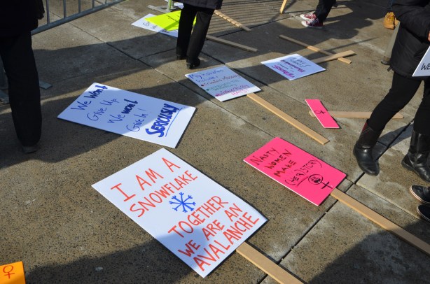 signs and placards ready to be used in a protest rally, womens march, I am a snowflake, together we are an avalanche 