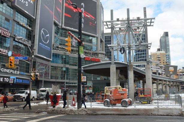 Yonge Dundas Square, men working on sign 