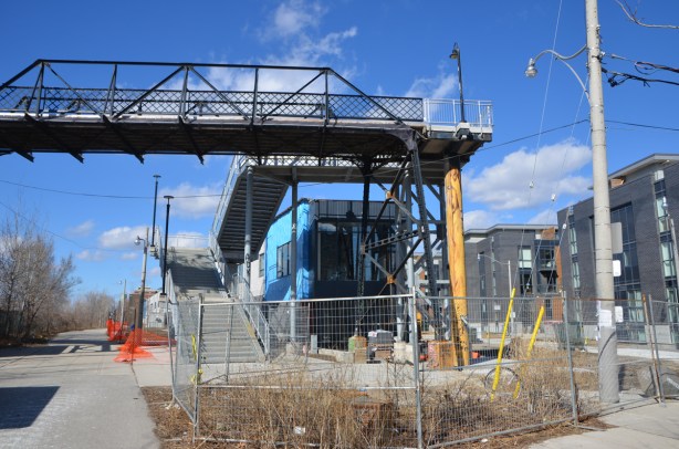 new stairs at the end of a footbridge over the train tracks at Wallace street in Toronto, beside the West Toronto Railpath