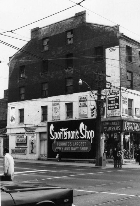old black and white photo of the Sportsmans Shop at 150 King East in Toronto, three storey brick building