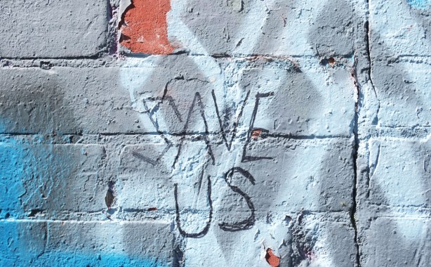 graffiti words on a wall, black sharpie, Save us 