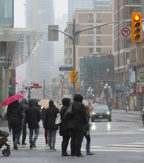 people walking in the rain, downtown Toronto