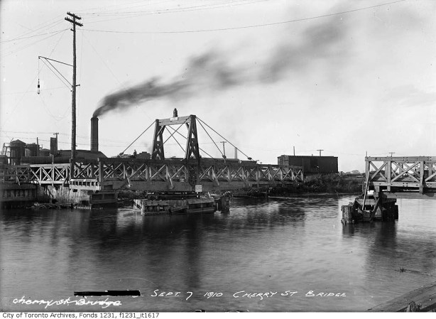 vintage photo, black and white, 1910 of wood swing bridge in open position, some boats around, Keating Channel, Cherry Street, Toronto, 