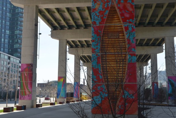 at the Bentway, Dana Claxton's 'Forest of Canoes' art installation of pictures of canoes on the concrete supports of the Gardiner Expressway - cedar strip canoe