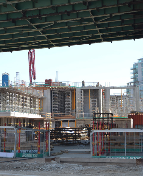 construction site that is partially covered by the Gardiner Expressway