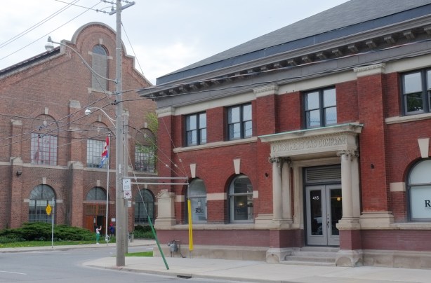 two brick buildings on a street 