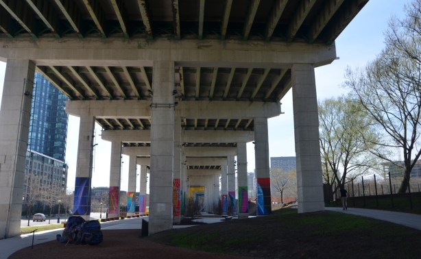 at the Bentway, Dana Claxton's 'Forest of Canoes' art installation of pictures of canoes on the concrete supports of the Gardiner Expressway 