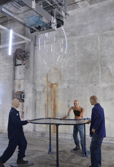 mannequin automatons as part of an art installation in the old Unilever soap factory, concrete floor and walls 