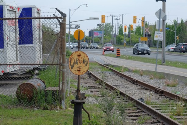 railway tracks running parallel to road, traffic, 