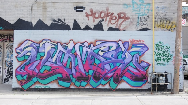 text graffiti by sightone, pinks and purples and red 