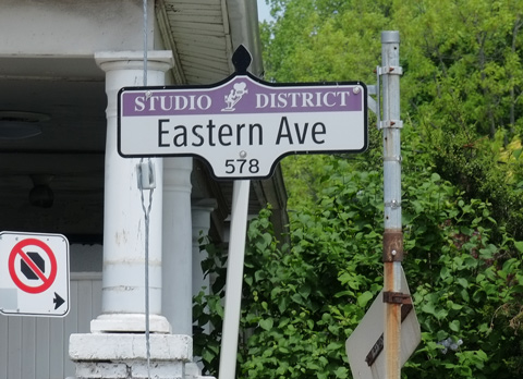 Toronto street sign that says Studio District, Eastern Avenue 