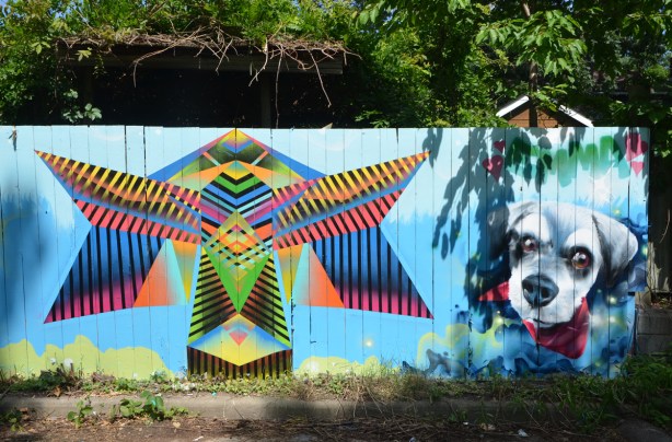 geometric striped butterfly with a dog head beside it. above dog is written the word Emma 