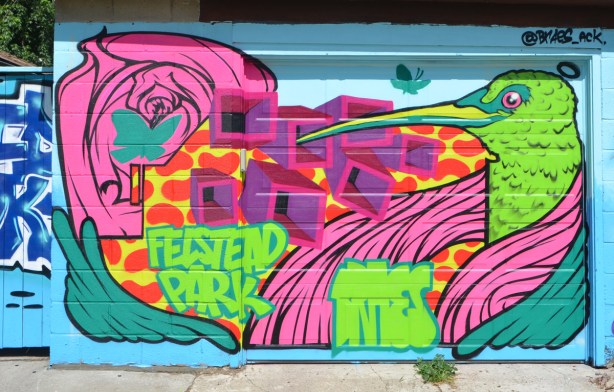 title mural on a garage door, Felstead Park murals, butterflies